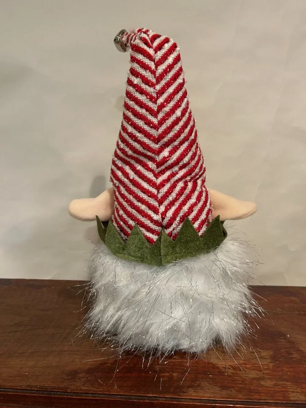 Christmas Holiday Gnome with red and white striped cap and wispy, sparkly white